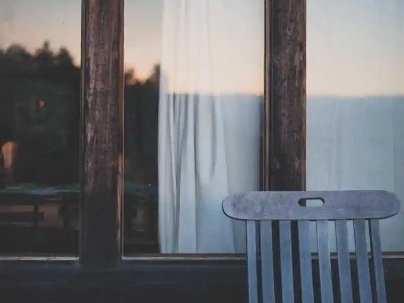 Person meditating by a home sauna